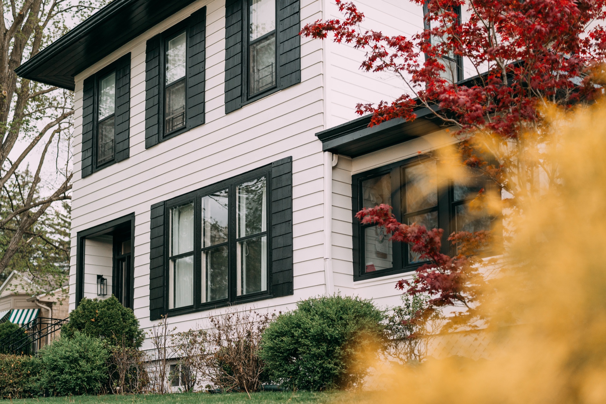 Crisp white siding with freshly painted black shutters