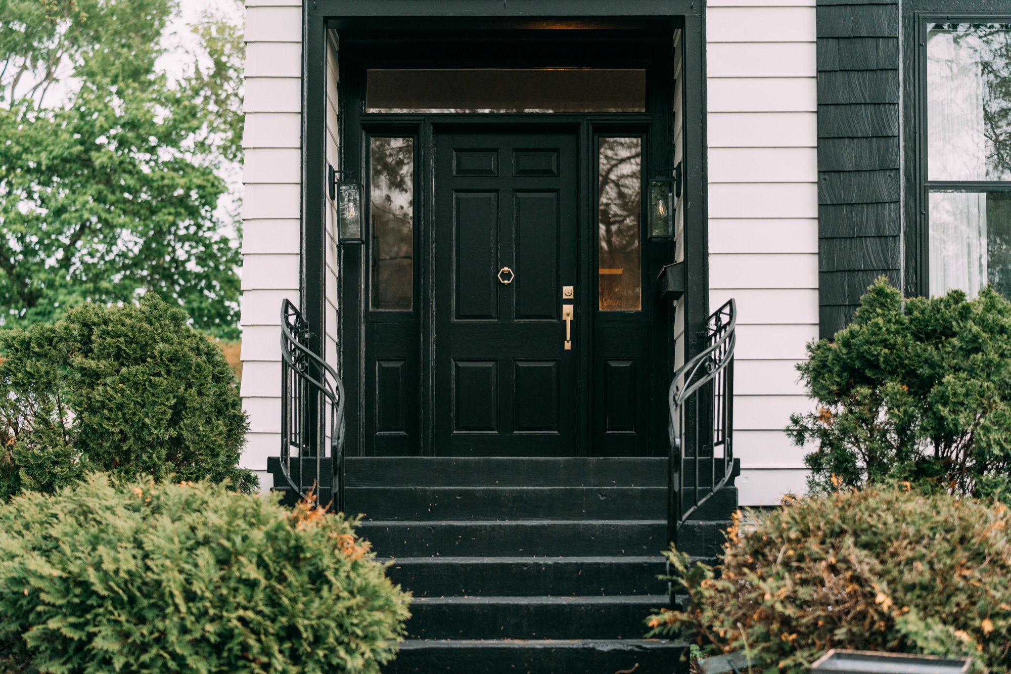 Sanded and repainted black front door with fresh steps