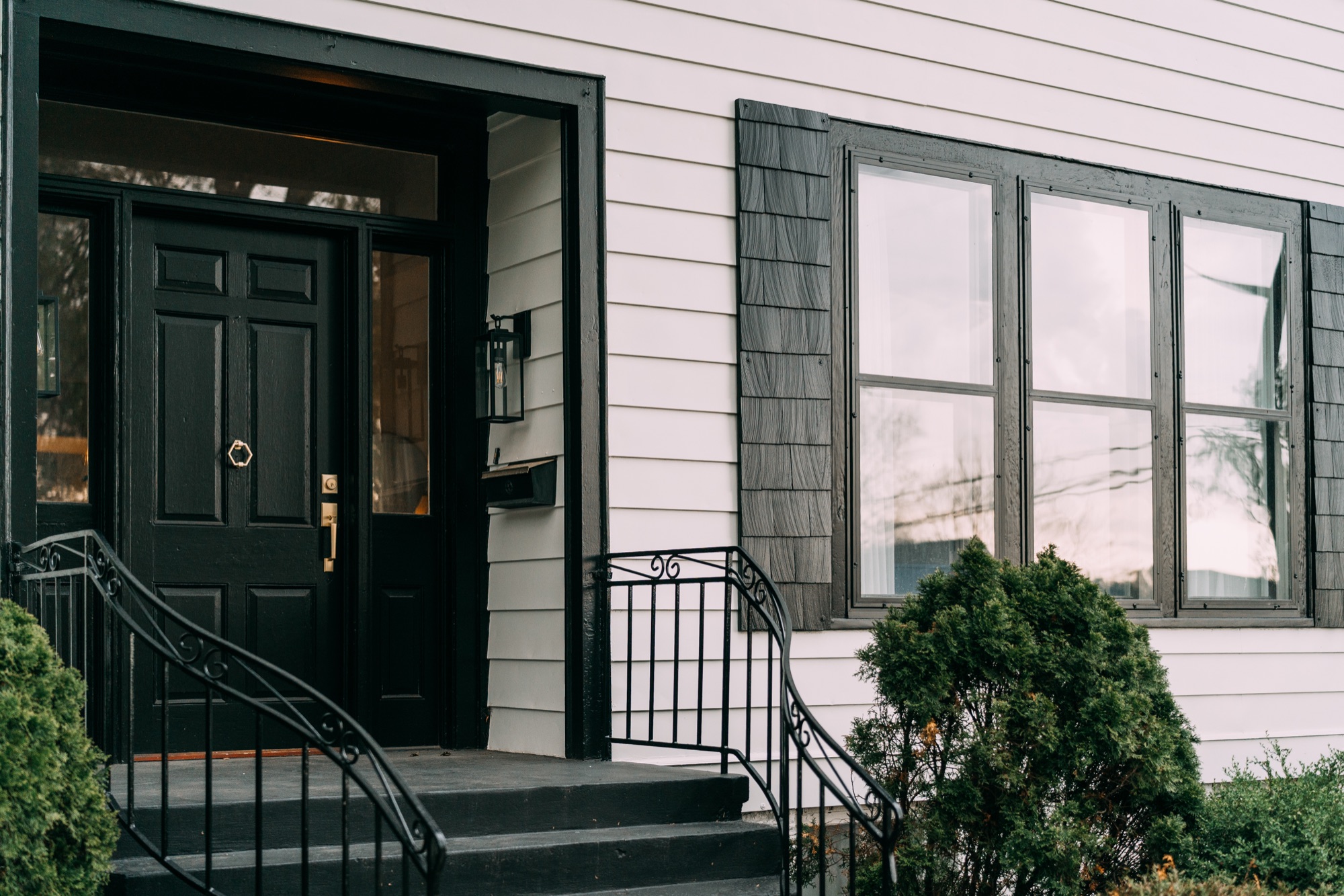 Freshly painted black shutters and window trim