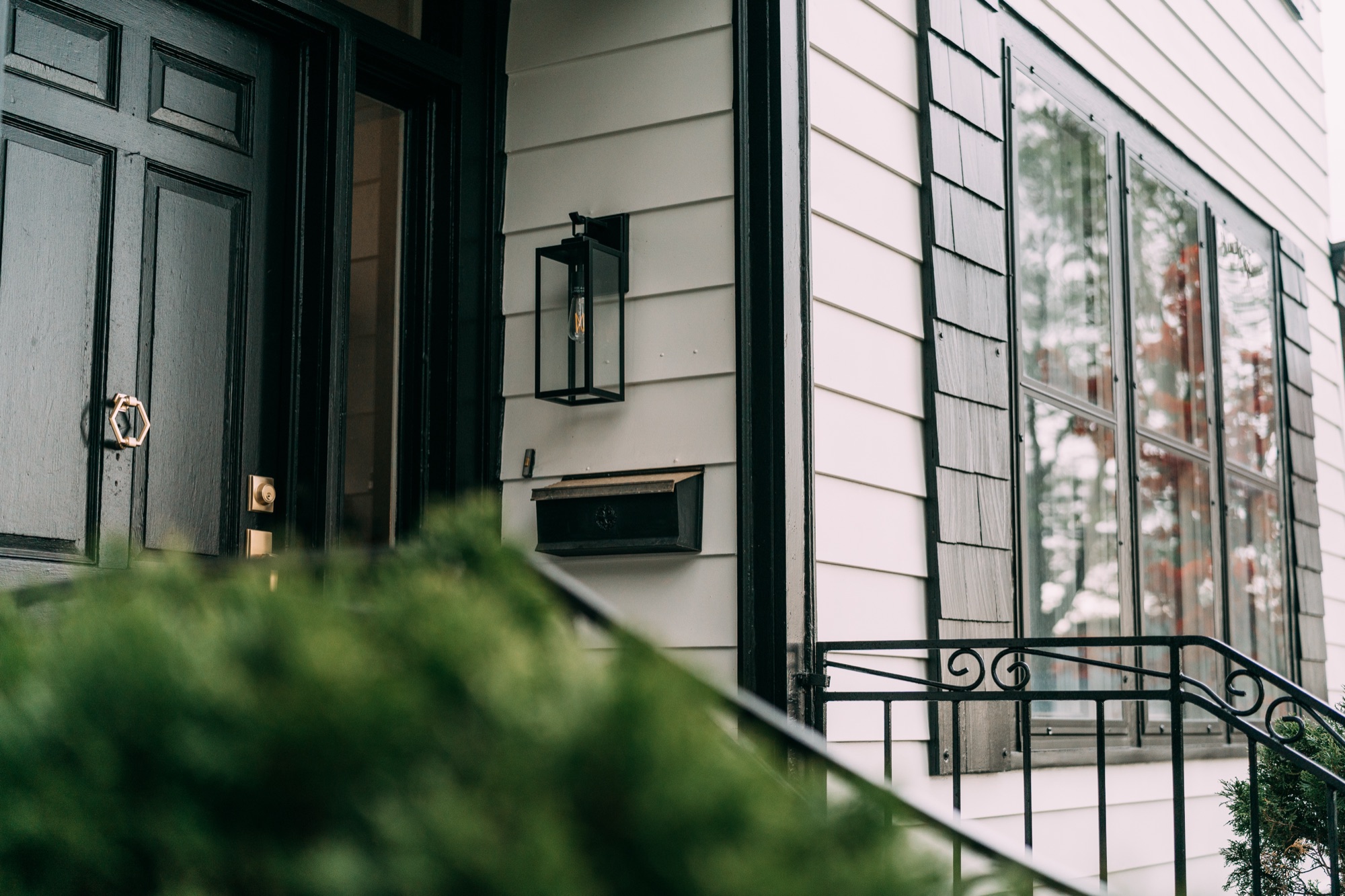 Precision cut-in paint around trim, mailbox and sconce