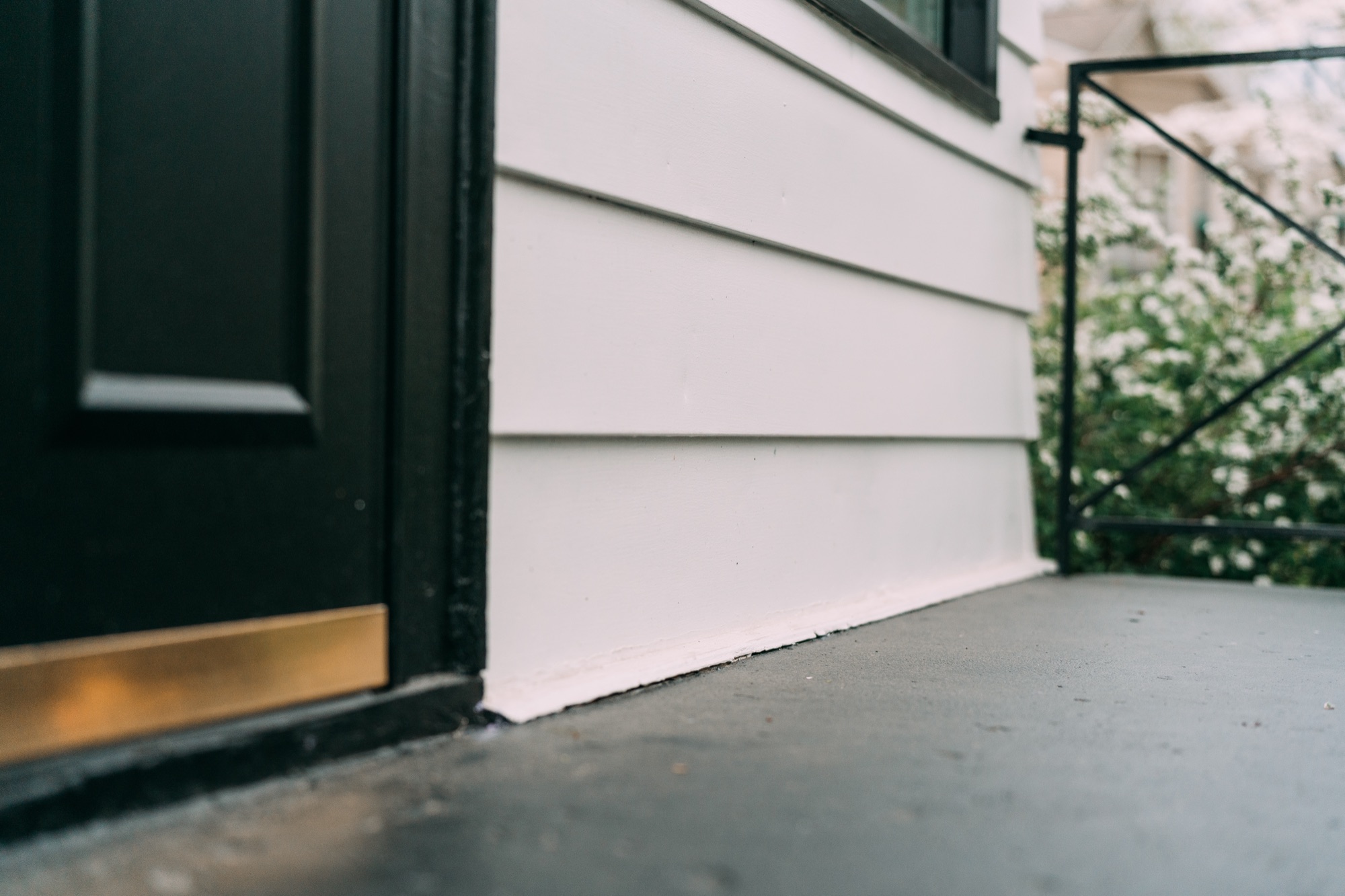 Freshly painted steps, threshold and siding base